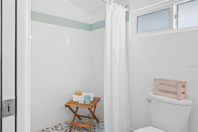 bathroom with toilet and tile patterned floors