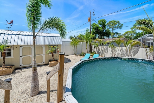 view of swimming pool with a storage unit