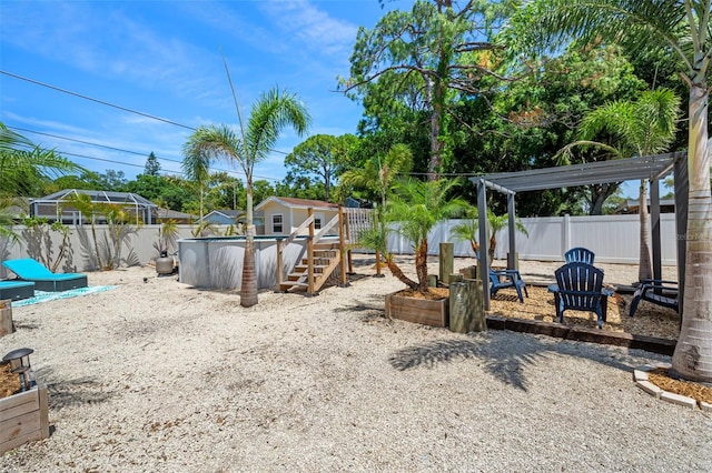 view of yard with a pergola and a storage unit