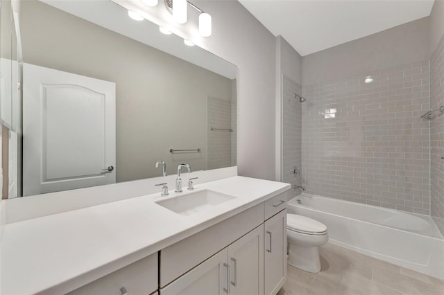 full bathroom with tile patterned floors, vanity, toilet, and tiled shower / bath