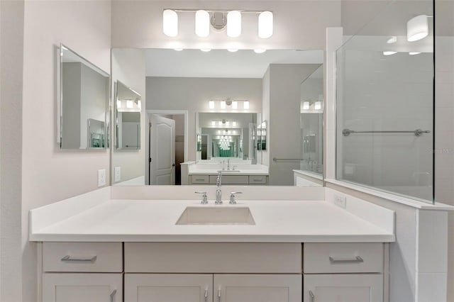 bathroom with a shower and vanity