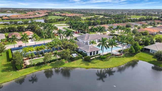 birds eye view of property with a water view