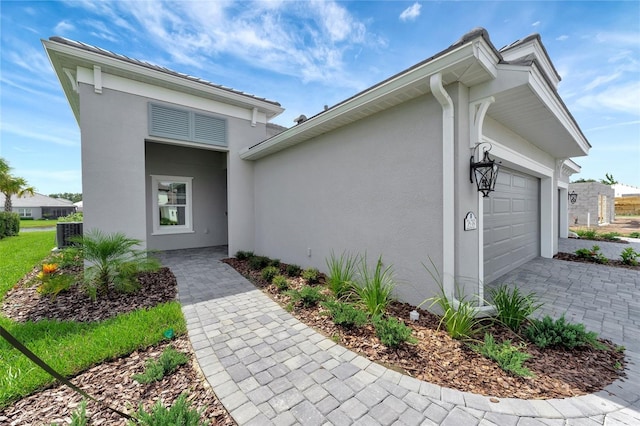 doorway to property featuring a garage