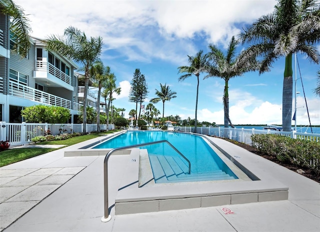 view of pool with a water view