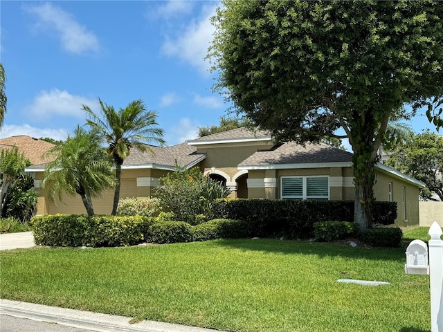 view of front of home featuring a front lawn