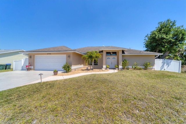 view of front facade featuring a front lawn and a garage