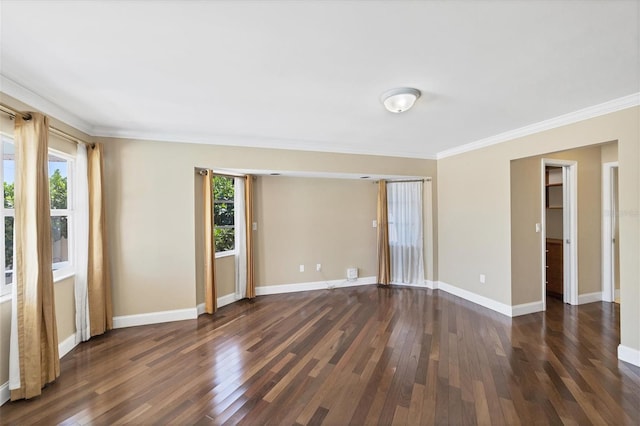 spare room featuring crown molding and dark hardwood / wood-style floors