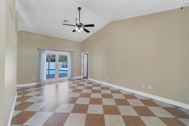 spare room featuring high vaulted ceiling, light tile floors, ceiling fan, and french doors