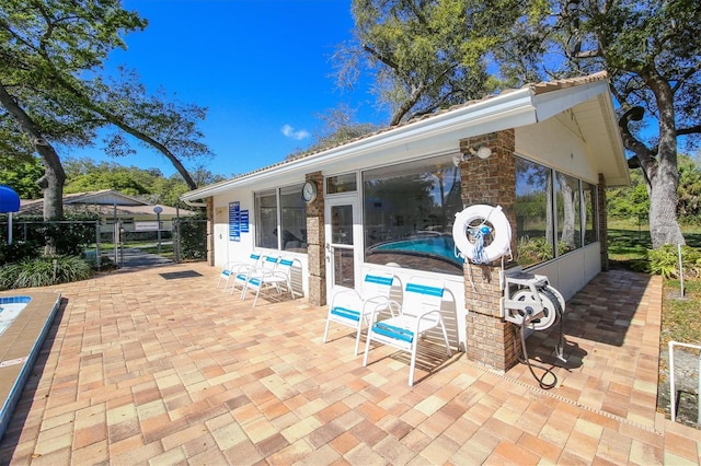 view of patio / terrace with a sunroom