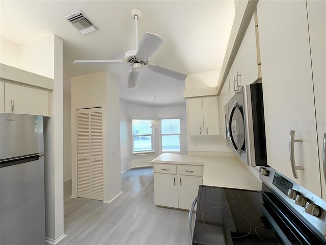 kitchen with decorative light fixtures, light hardwood / wood-style floors, stainless steel appliances, white cabinetry, and ceiling fan