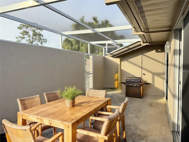 view of patio / terrace with glass enclosure and area for grilling