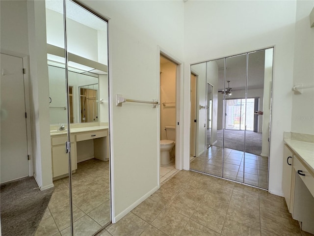 bathroom featuring tile patterned floors, toilet, and vanity