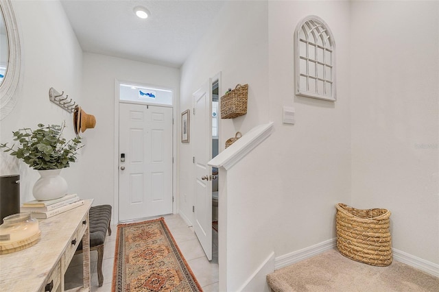 entryway with light tile flooring