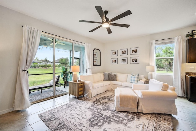 tiled living room featuring ceiling fan