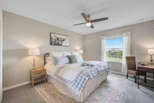 bedroom with ceiling fan and light carpet