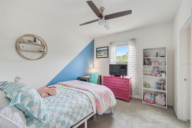 bedroom featuring light colored carpet and ceiling fan