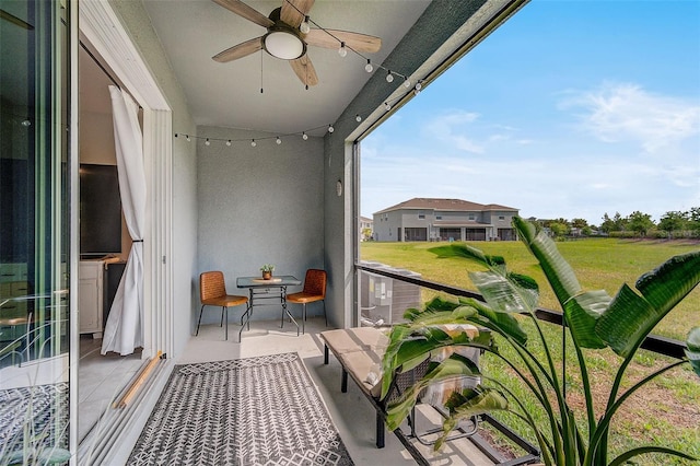 balcony featuring ceiling fan