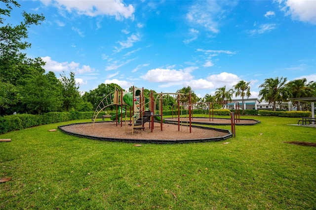 view of playground with a lawn