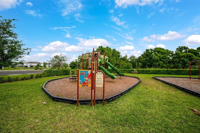 view of jungle gym with a lawn