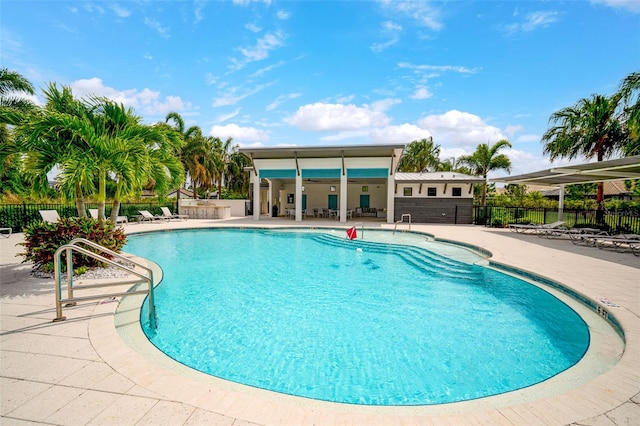 view of swimming pool with a patio