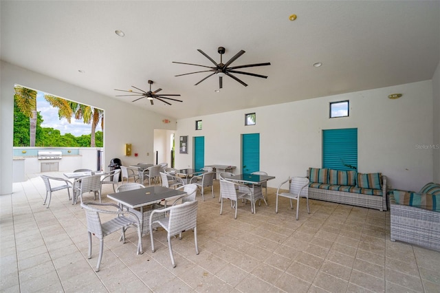 dining area with light tile floors and ceiling fan