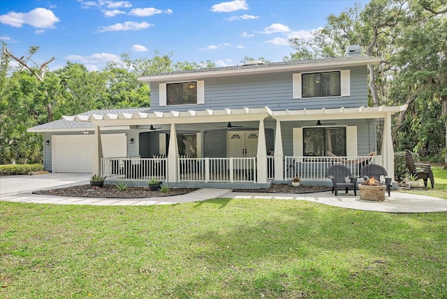 view of front facade featuring a pergola, covered porch, and a front lawn