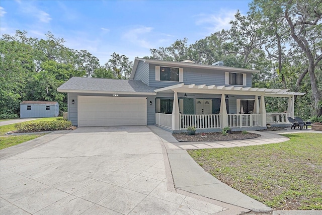 view of front of house with a pergola, a front lawn, and a storage shed