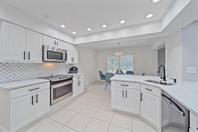 kitchen featuring white cabinets, sink, and stainless steel appliances