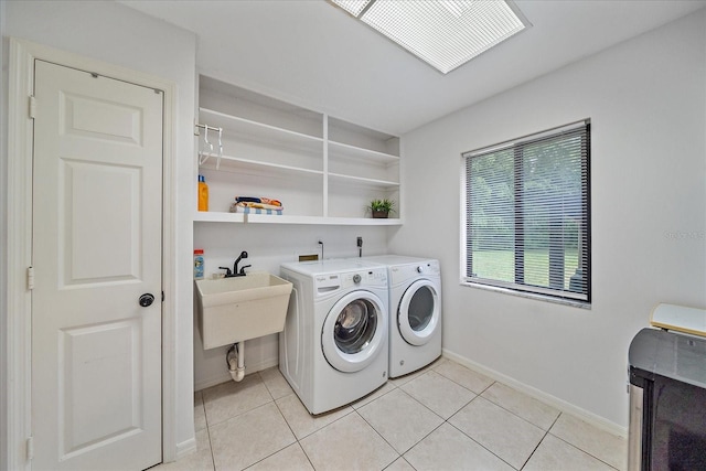 laundry area featuring independent washer and dryer, washer hookup, light tile flooring, and hookup for an electric dryer