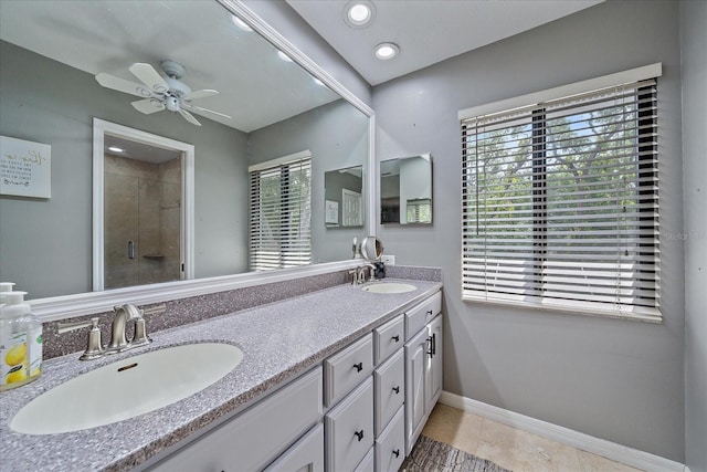 bathroom with double vanity, ceiling fan, walk in shower, and tile floors