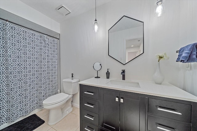 bathroom with oversized vanity, toilet, and tile flooring