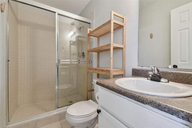 bathroom featuring toilet, tile flooring, walk in shower, and vanity