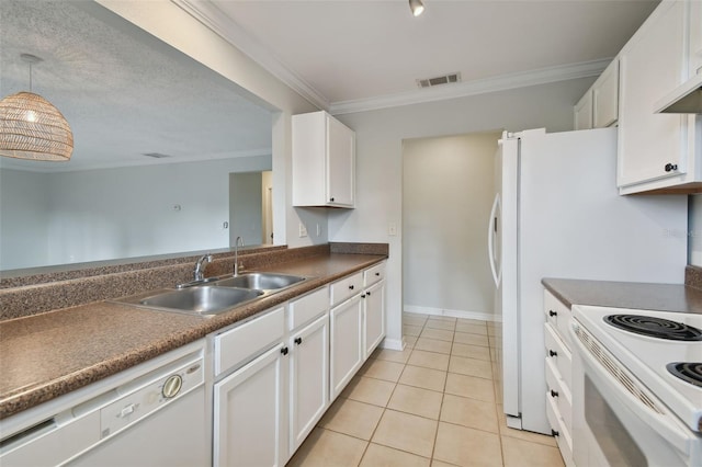 kitchen featuring white appliances, sink, white cabinets, light tile flooring, and decorative light fixtures