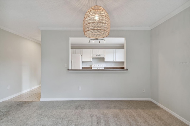 carpeted empty room featuring crown molding