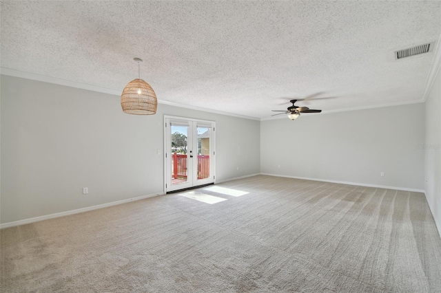 carpeted spare room with crown molding, a textured ceiling, and ceiling fan