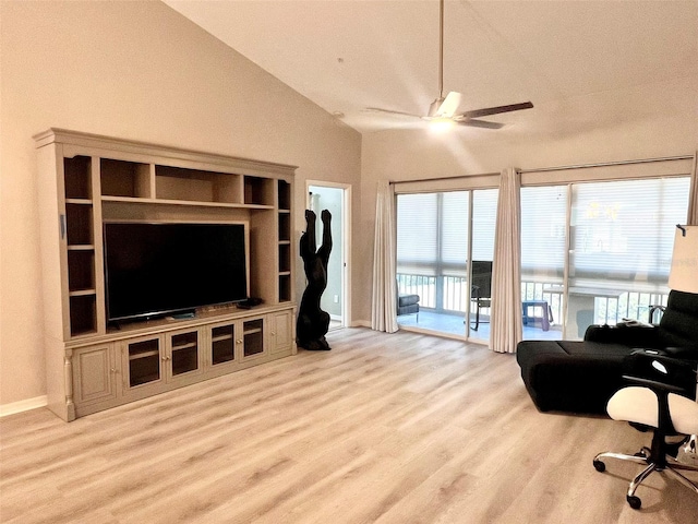 living room featuring high vaulted ceiling, light hardwood / wood-style floors, ceiling fan, and plenty of natural light