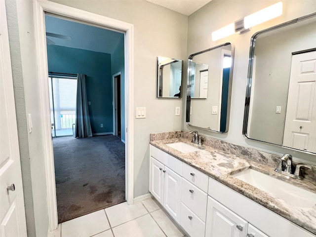 bathroom with double sink vanity and tile floors