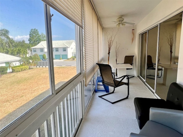 sunroom / solarium with a healthy amount of sunlight and ceiling fan