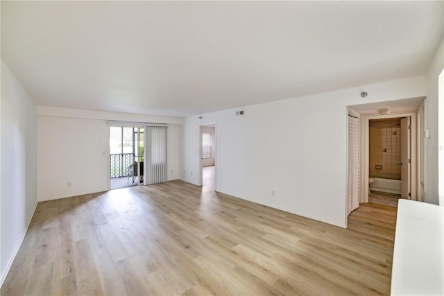 empty room with light wood-type flooring