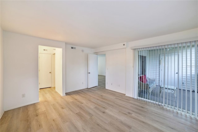 unfurnished room featuring light hardwood / wood-style floors