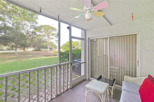 sunroom / solarium with ceiling fan