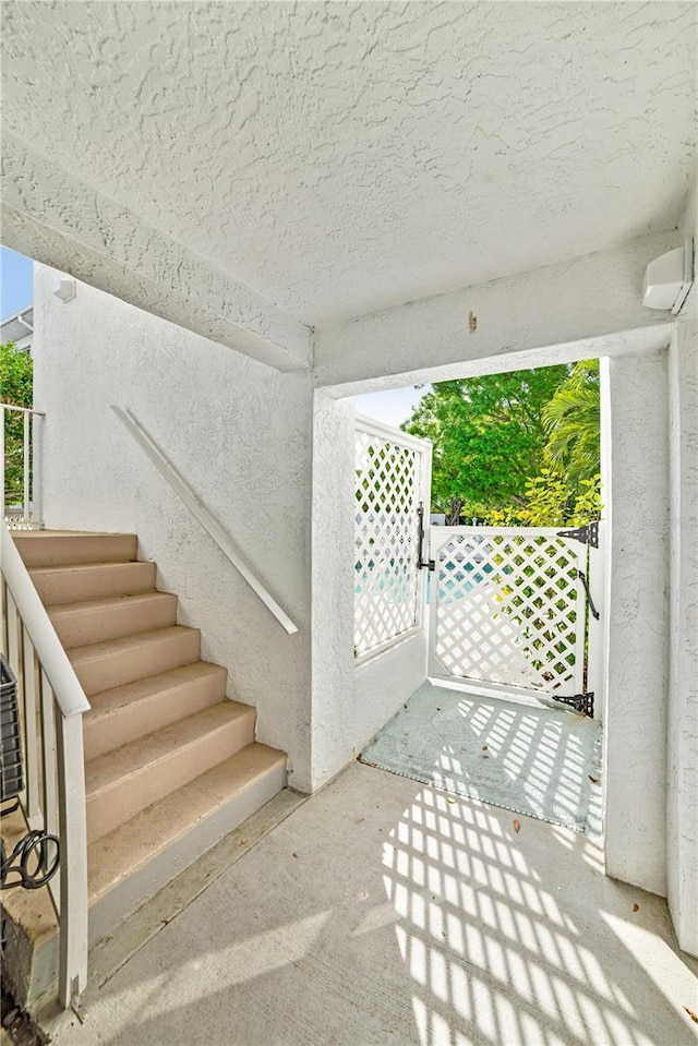 view of patio / terrace with a gate and stairway