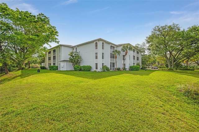 view of home's exterior featuring a lawn