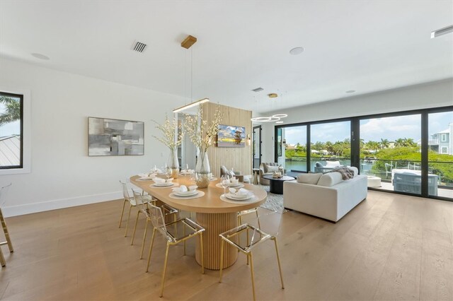 dining area with light wood-type flooring