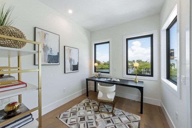 office with light hardwood / wood-style flooring