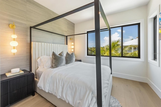 bedroom with light wood-type flooring