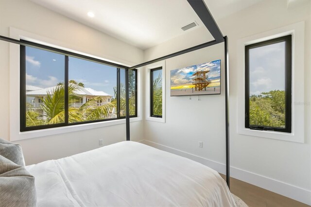 bedroom featuring wood-type flooring