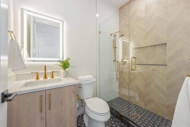 bathroom featuring tile patterned floors, walk in shower, toilet, and vanity