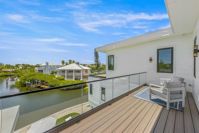 wooden terrace with a water view