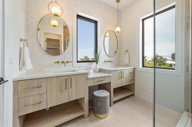 bathroom featuring vanity, tasteful backsplash, and hardwood / wood-style flooring